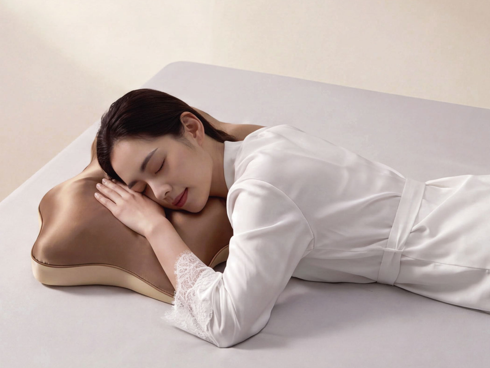 Side view of a butterfly-contoured brown pillow in use
