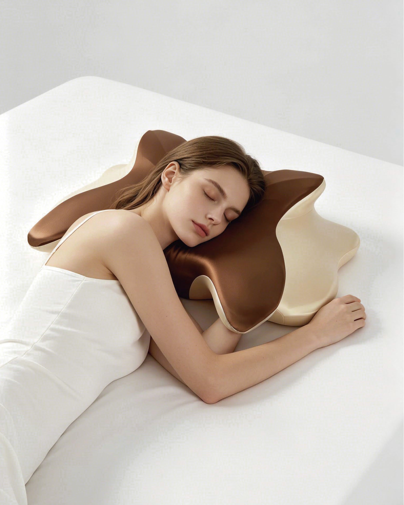 Brown wraparound pillow shown in a light bedroom setting